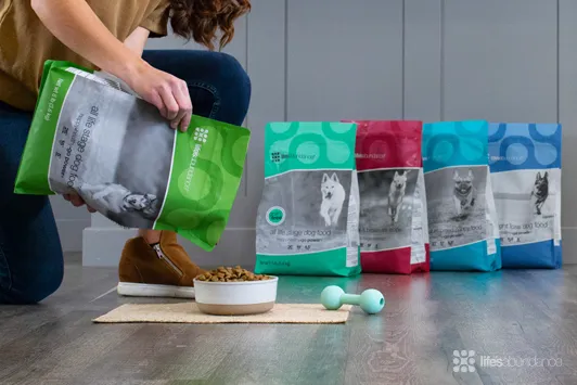  woman pouring Life's Abundance ppet foods